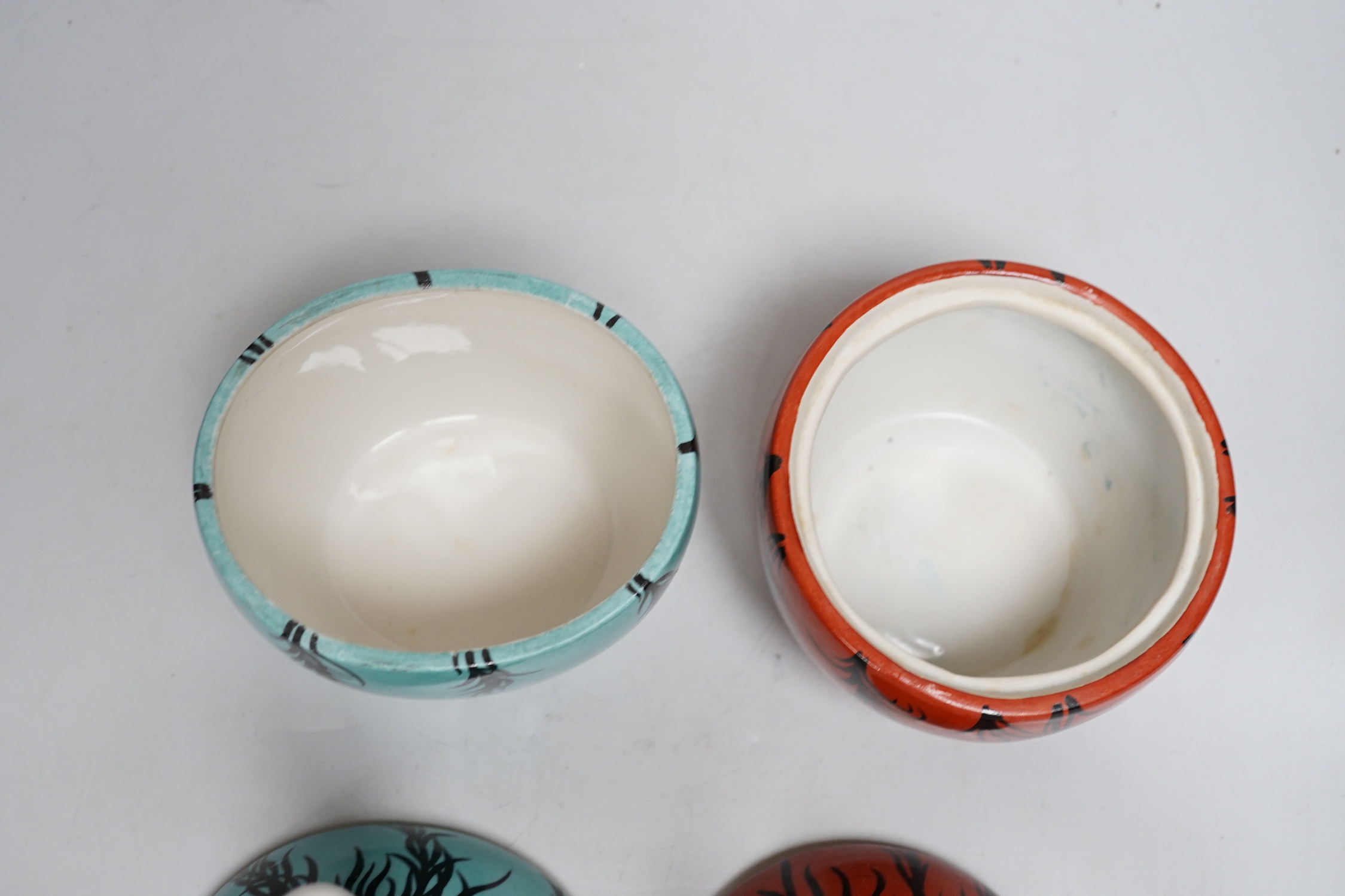 A 1930’s Robj figural ‘dancer’ powder bowl and cover and a similar powder bowl and cover, maker’s stamp on base, tallest 20cm